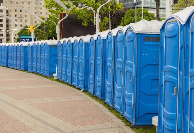 a row of portable restrooms at a fairground, offering visitors a clean and hassle-free experience in fayetteville